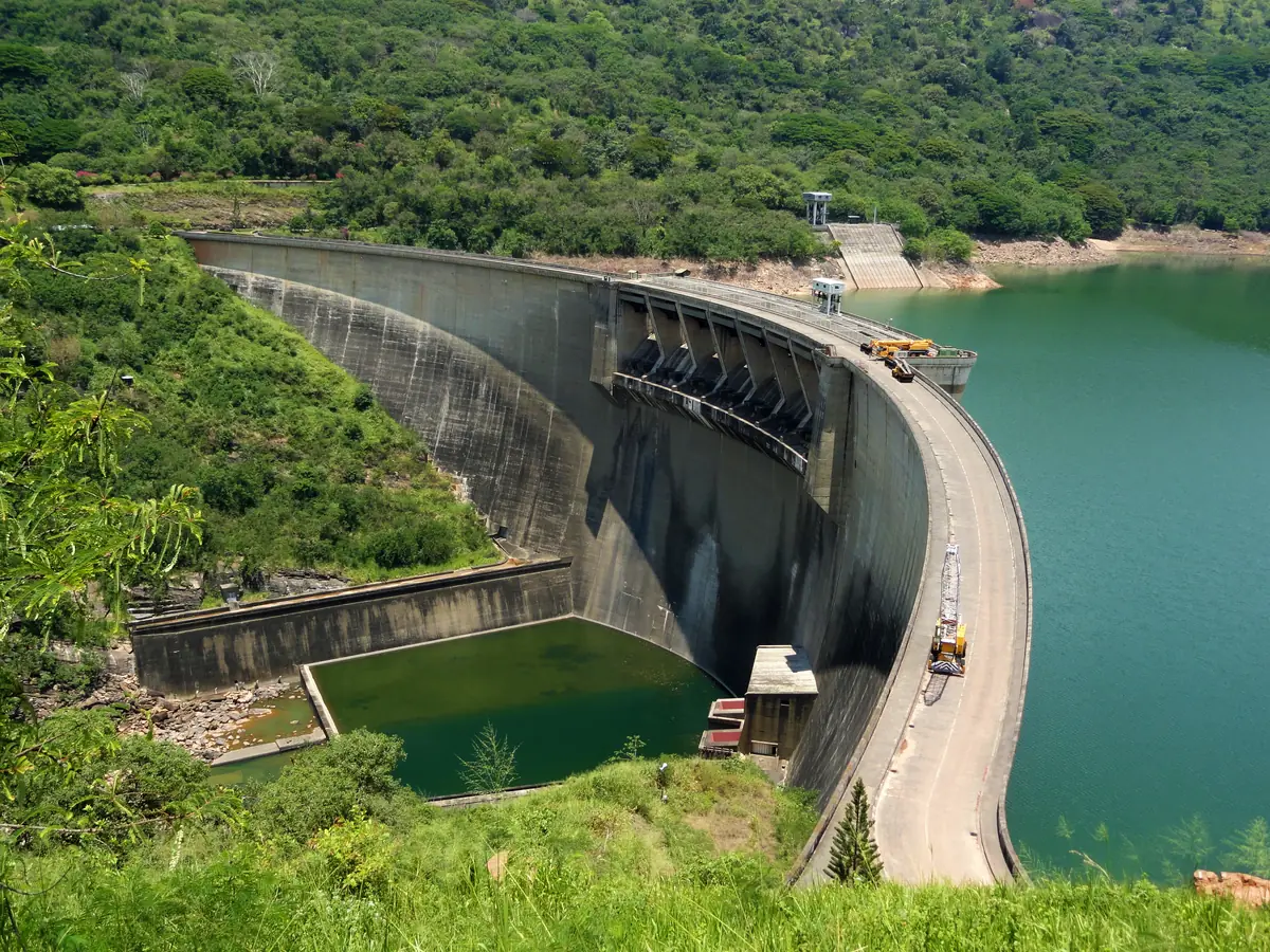 Victoria Dam in Sri Lanka, a curved concrete dam holding back a reservoir.