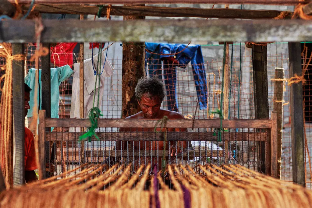 Weaver at a handloom in a Sri Lankan textile workshop